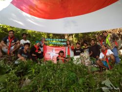 Peringati HUT Kolut ke 15, KPA   Kibarkan Bendera Raksasa di Mulut Gua